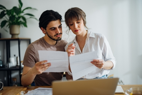 couple reviewing documents at home