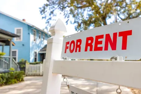 for rent sign in front of a house
